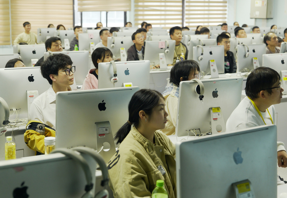 Workers attend a skills training course at a learning center of Foxconn in Zhengzhou, central China's Henan Province, on Oct. 12, 2024. [XINHUA/YONHAP]