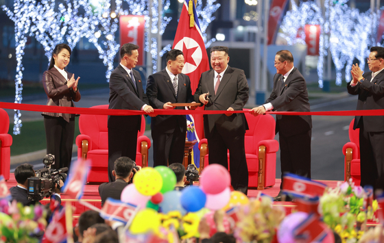 North Korean leader Kim Jong-un, third from right, attends a ceremony marking the completion of the third-stage section of the Hwasong new town in Pyongyang on April 15. [YONHAP]