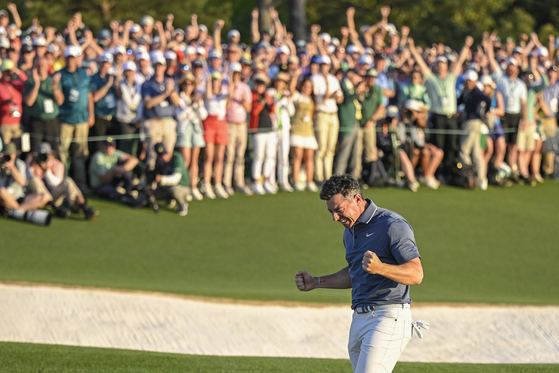 Rory McIlroy celebrates following his playoff victory on the 18th hole green during the final round of the Masters Tournament at Augusta National Golf Club on April 13 in Augusta, Georgia. [GETTY IMAGES]