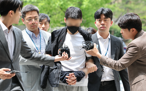 A man surnamed Kang who ordered the vandalizing of Gyeongbok Palace attends his court hearing at Seoul Central District Court in Seocho District, southern Seoul on May 25, 2024. [YONHAP]