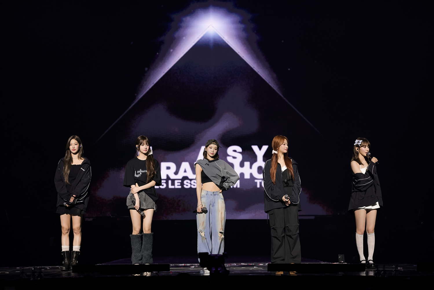 Le Sserafim performs during its first world tour ″Easy Crazy Hot″ at the Inspire Arena in Incheon on April 20. [SOURCE MUSIC]
