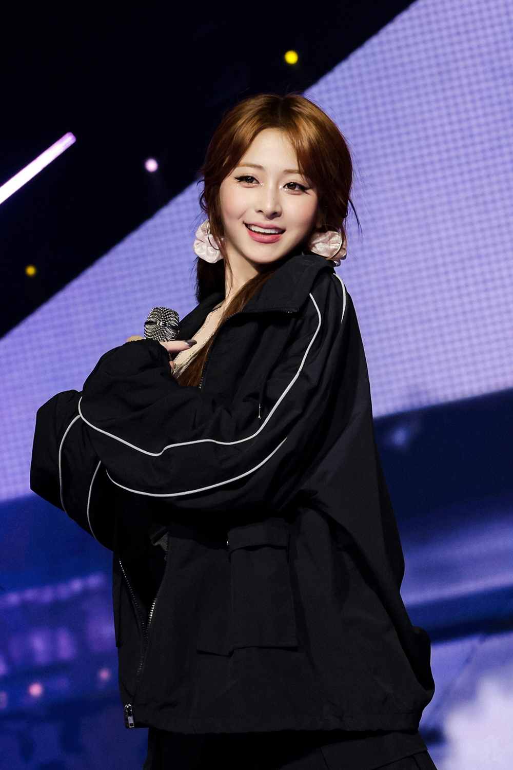 Le Sserafim's Huh Yun-jin performs during its first world tour ″Easy Crazy Hot″ at the Inspire Arena in Incheon on April 20. [SOURCE MUSIC]