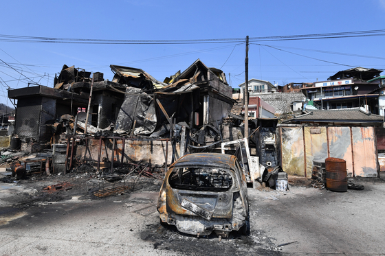 Parts of the coastal village of Nomul-ri in Yeongdeok County, North Gyeongsang, are blackened by wildfire damage on March 29. [NEWS1]