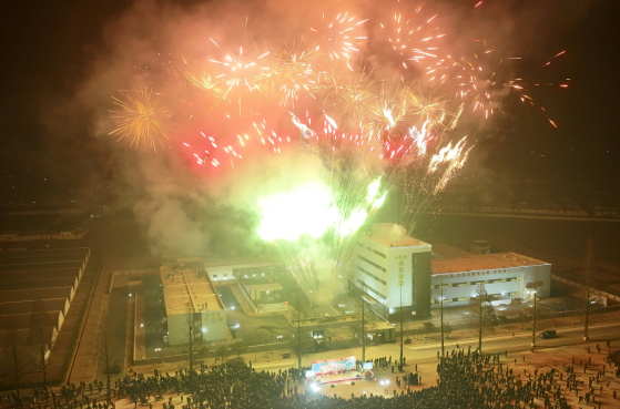 Fireworks are set off during a groundbreaking ceremony at a factory in Nampo City in North Korea on Jan. 21. [YONHAP] 