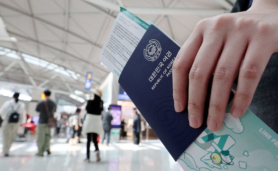 A person holds a passport at Incheon International Airport on July 1, 2024. [NEWS1] 