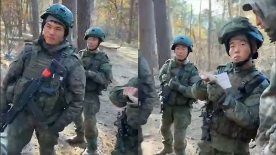 In this screenshot of a video released by Ukrainian media, North Korean soldiers deployed to Russia are seen on the battlefield in the Kursk Oblast in southwestern Russia on Dec. 5 last year. [SCREEN CAPTURE]