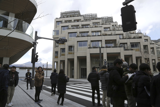 Reporters see the apartment complexes and the roads where a mobility will be tested at Toyota’s Woven City during a tour in Susono, Shizuoka prefecture, Saturday, Feb. 22. [AP/YONHAP]
