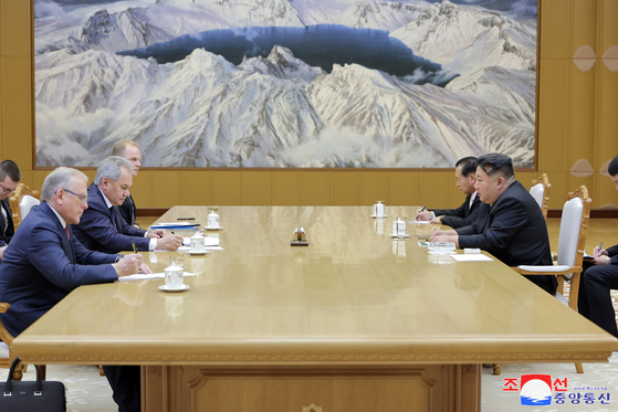 North Korean leader Kim Jong-un meets with Sergei Shoigu, secretary of Russia’s Security Council, during his visit to Pyongyang on March 21, as seen in this photo released by the Korean Central News Agency on March 22. [KOREAN CENTRAL NEWS AGENCY]