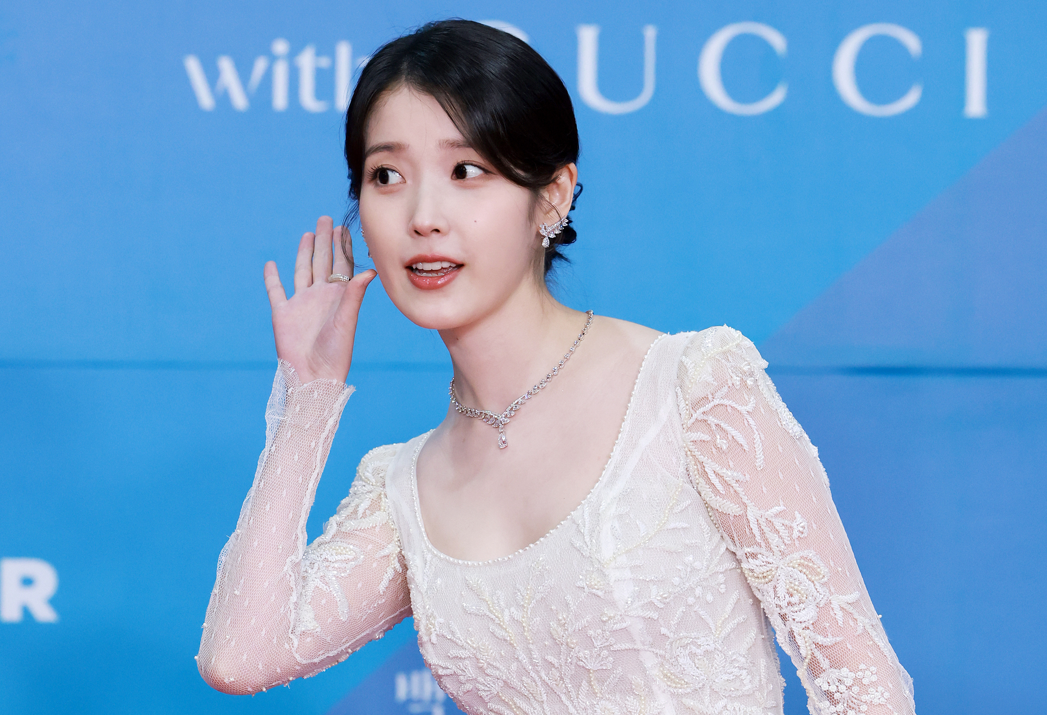 Singer and actor IU poses for a photo on the red carpet ahead of the 61st Baeksang Arts Awards ceremony held on May 5 in Coex, southern Seoul. [NEWS1]