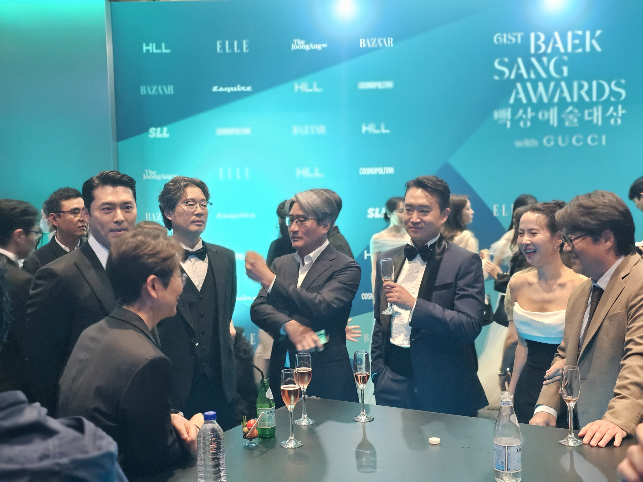 ″Harbin″ (2024) actor Hyun Bin, left, actor Jo Woo-jin and actor Cho Yeo-jeong converse during a reception ahead of the 61st Baeksang Arts Awards held at Coex in Gangnam District, southern Seoul, on May 5. [SHIN HA-NEE]