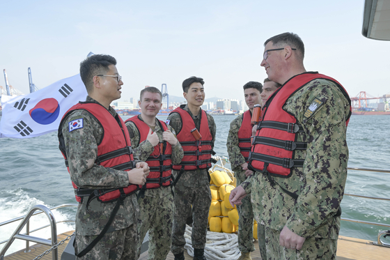 This file photo, provided by the South Korean Navy, shows Rear Adm. Neil Koprowski, right, commander of U.S. Naval Forces Korea. [YONHAP]  