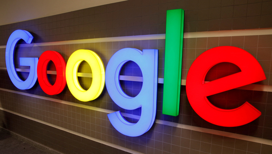 An illuminated Google logo is pictured inside an office building in Zurich, Switzerland, in December 2018. [REUTERS/YONHAP]
