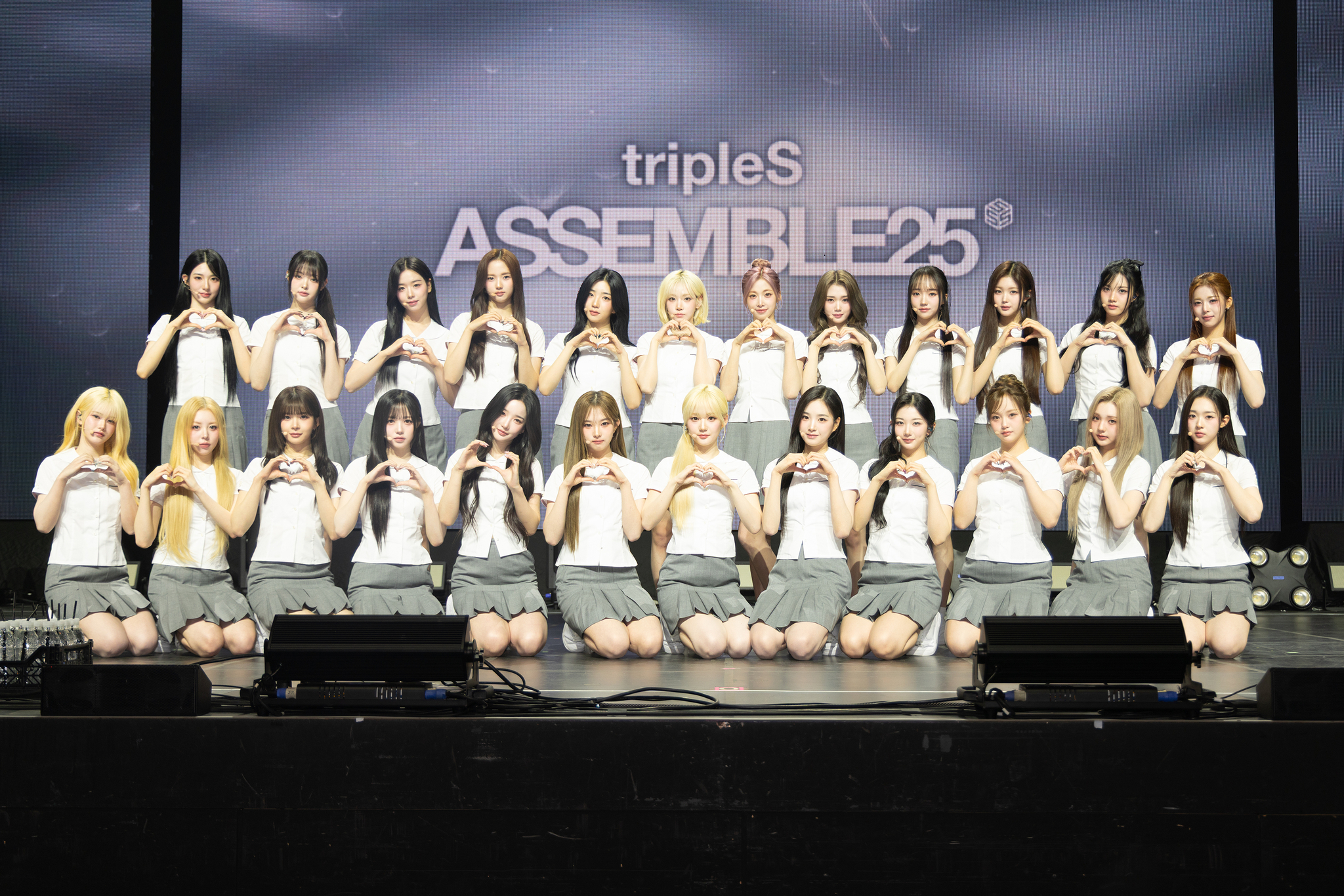 Girl group tripleS poses for photos during a showcase at Blue Square in central Seoul for the release of its second full-length album, “Assemble25,” on May 12. [MODHAUS]