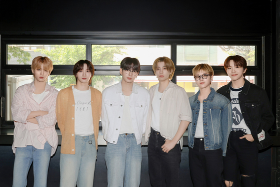 Members of boy band BoyNextDoor pose for photos prior to an interview with reporters on May 9 in western Seoul. [KOZ ENTERTAINMENT]