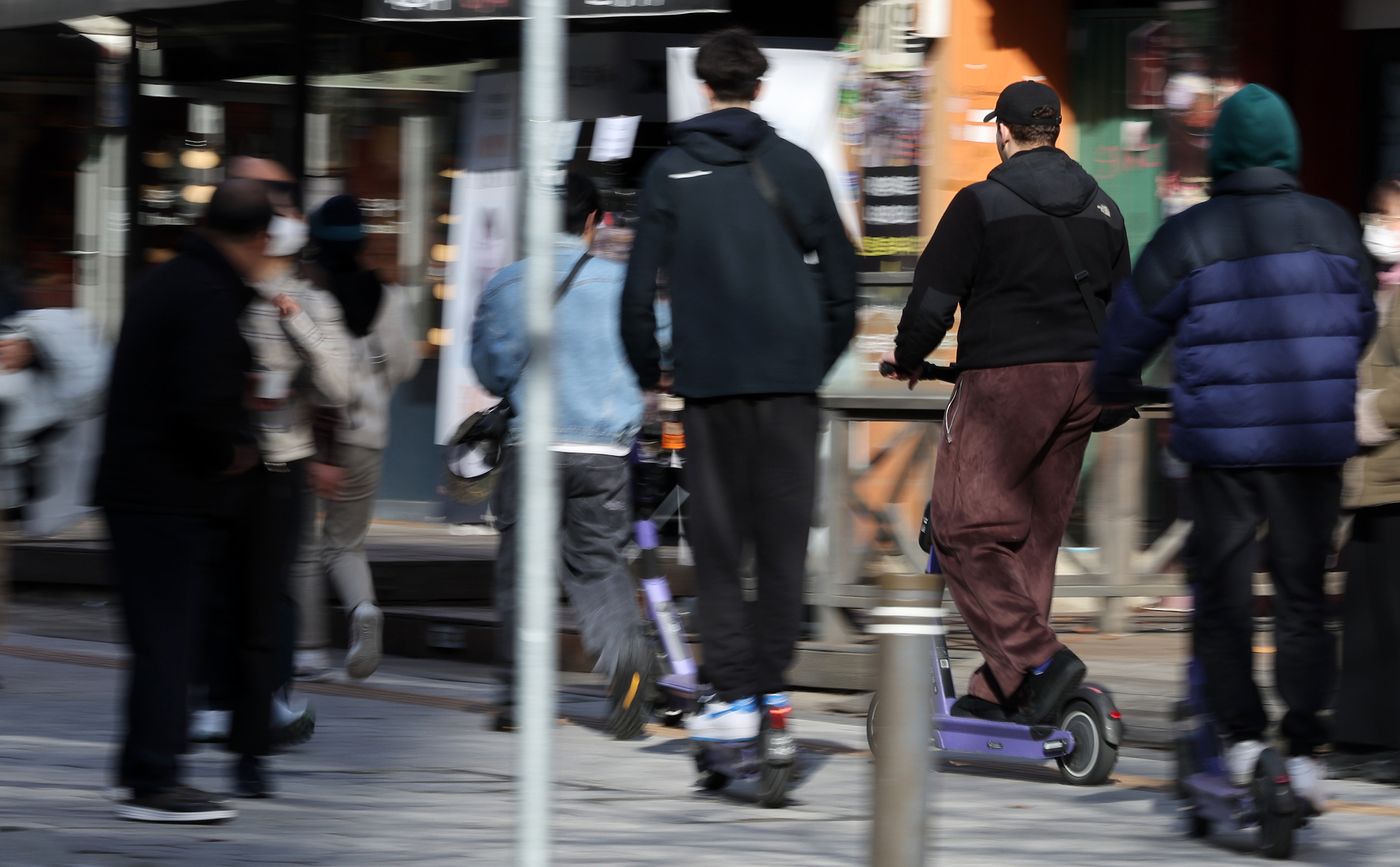 Tourists ride electric scooters in downtown Seoul on Nov. 19, 2024. [NEWS1]