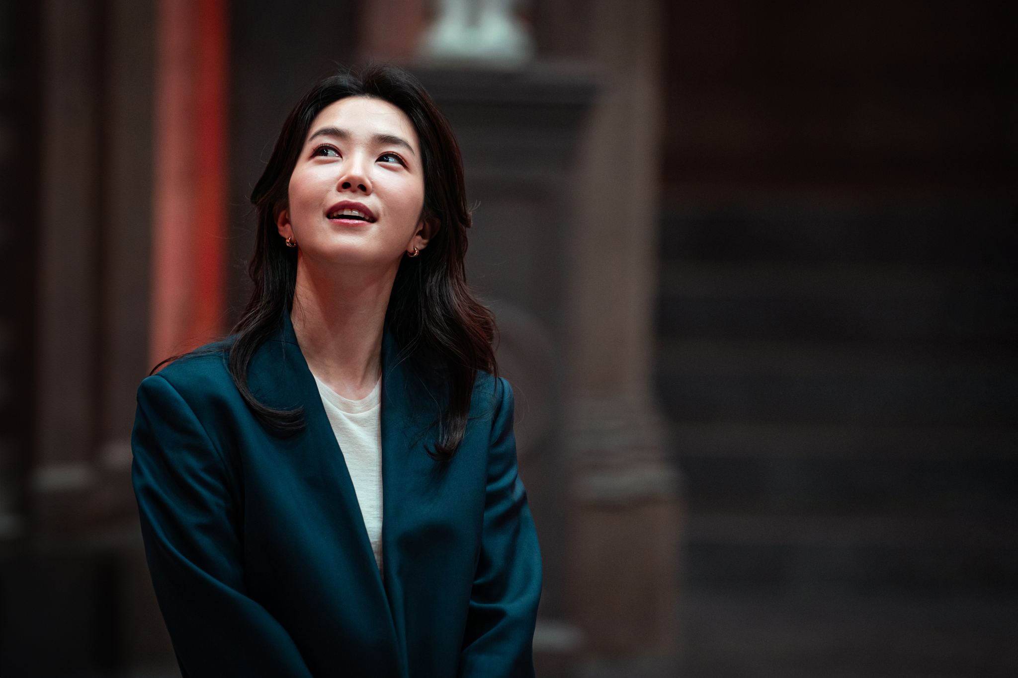 A still from the second season of Netflix's mind-game survival show ″The Devil's Plan: Death Room,″ featuring announcer Kang Ji-yeong [NETFLIX]
