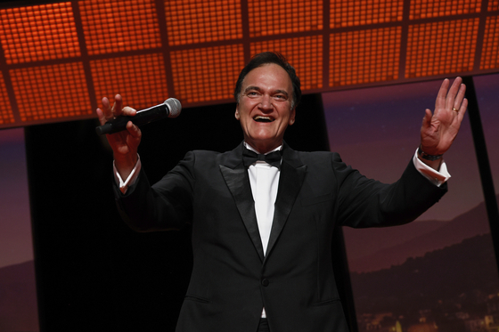Quentin Tarantino addresses the audience during the opening ceremony of the 78th international film festival, Cannes, southern France, May 13. [AP/YONHAP]