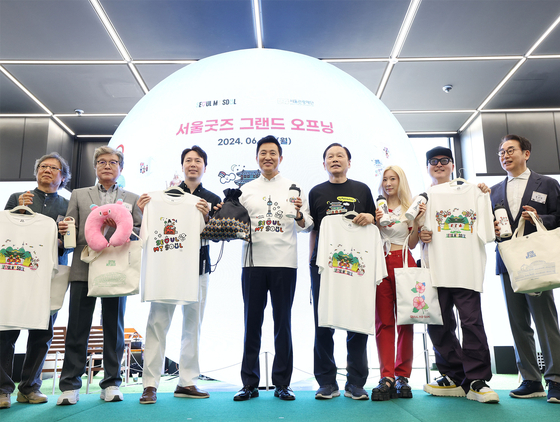 Seoul Mayor Oh Se-hoon and Seoul Tourism Organization CEO Kil Gi-yeon pose for a photo during an opening ceremony for Seoul My Soul Shop, an official store for souvenirs of the city, at the Seoul Tourism Plaza in Jongno District, central Seoul on June 10, 2024. [YONHAP] 