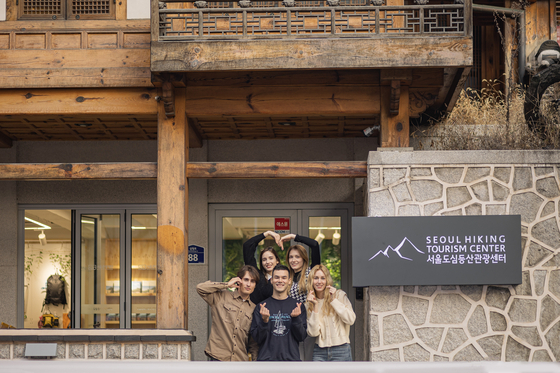 Tourists pose for a photo at the Mount Bukak branch of the Seoul Hiking Tourism Center, operated by the Seoul Tourism Organization [SEOUL TOURISM ORGANIZATION]