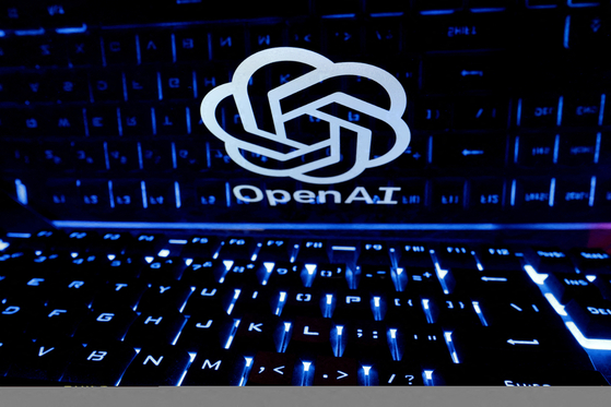 A keyboard is placed in front of a displayed OpenAI logo in this illustration taken Feb. 21, 2023. [REUTERS/YONHAP]
