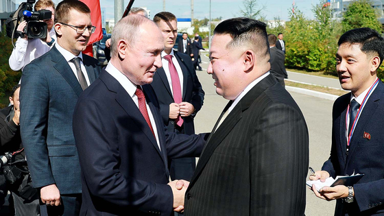 Russian President Vladimir Putin, left, and North Korea's leader Kim Jong Un shake hands during their meeting at the Vostochny cosmodrome outside the city of Tsiolkovsky, about 200 kilometers (125 miles) from the city of Blagoveshchensk in the far eastern Amur region, Russia, on Wednesday, Sept. 13, 2023. (Vladimir Smirnov, Sputnik, Kremlin Pool Photo via AP)