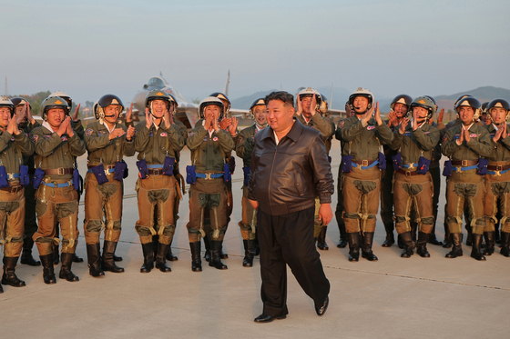 North Korean leader Kim Jong-un, front, visits a flight regiment under the 1st Guards Air Division of the Korean People's Army on May 15. [NEWS1]