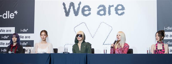 Members of girl group i-dle speak during a press conference held at Josun Palace hotel in southern Seoul for the release of its eighth EP ″We are″ on May 19. [DANIELA GONZALEZ PEREZ]