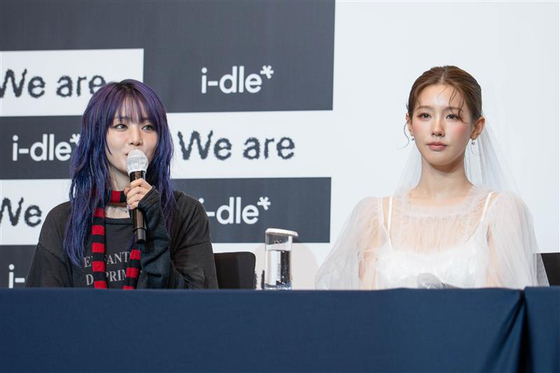Members of girl group i-dle speak during a press conference held at Josun Palace hotel in southern Seoul for the release of its eighth EP ″We are″ on May 19. [DANIELA GONZALEZ PEREZ]