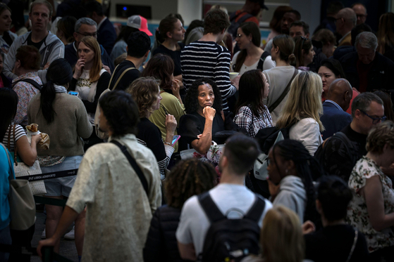 Passengers wait at Humberto Delgado airport after most of the boarding controls resumed operations following a major blackout, in Lisbon, Portugal, on April 19. [EPA/YONHAP]