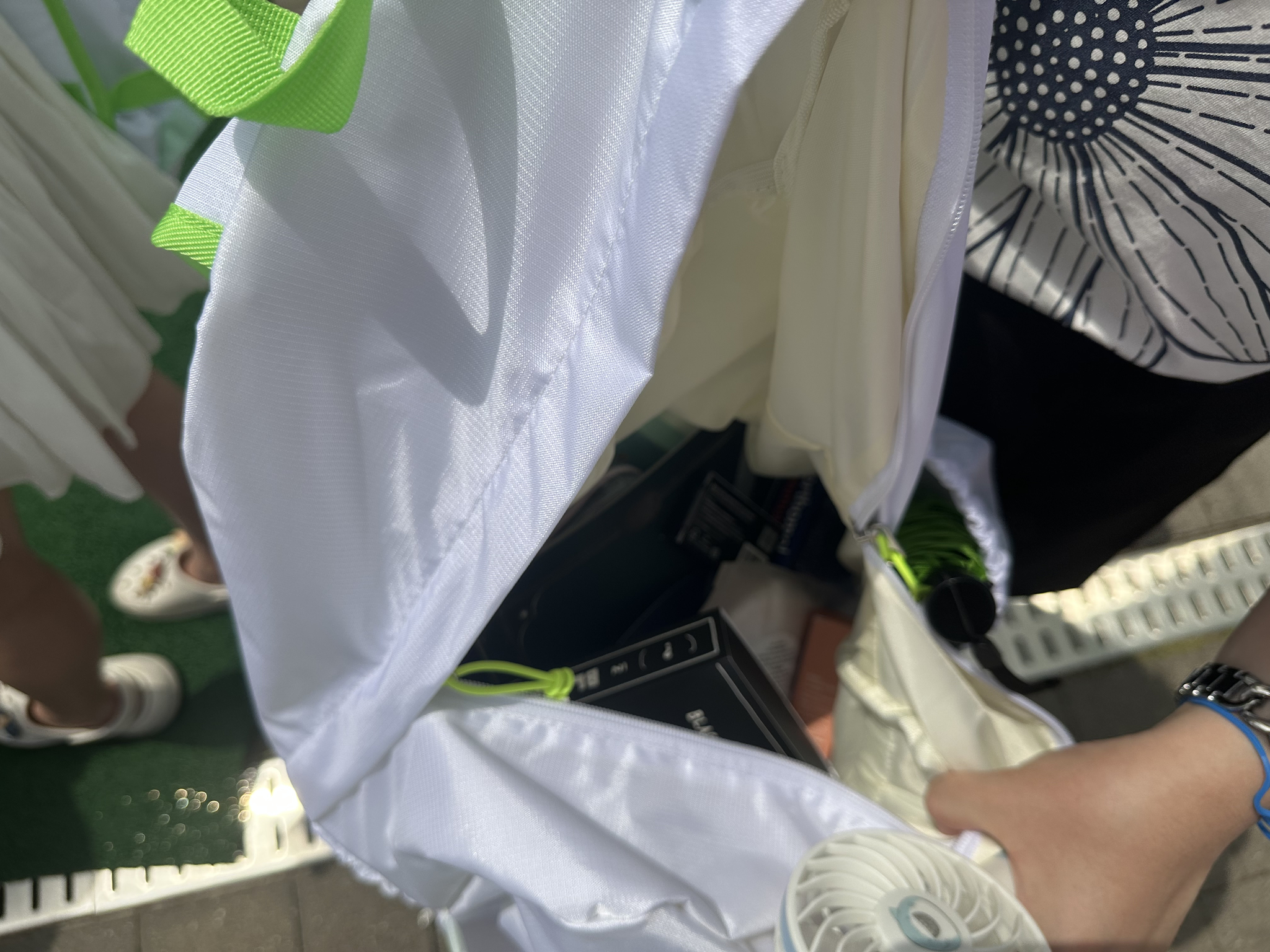 An Olive Young bag belonging to an attendee is filled with samples she received at the 2025 Olive Young Festa on May 21. [WOO JI-WON]