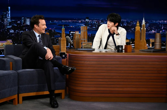 BTS member Jin asks questions to host Jimmy Fallon on NBC's "The Tonight Show Starring Jimmy Fallon" on May 21. [NBC]