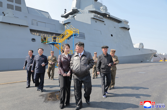 North Korean leader Kim Jong-un, center, observes the first weapons test of the new multipurpose destroyer Choe Hyon, held three days after its launch on April 30. [YONHAP] 