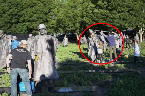 U.S. Secretary of Defense Pete Hegseth is seen cleaning statues and monuments at the Korean War Veterans Memorial in Washington ahead of Memorial Day on May 25. [U.S. DEPARTMENT OF DEFENSE]