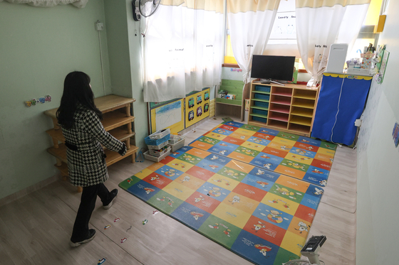 A teacher looks over a day care center about to close on Feb. 23, 2023, after seeing too few children. [YONHAP]