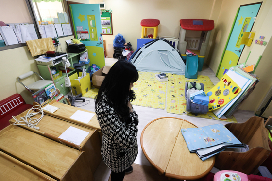 A teacher looks over a day care center about to close on Feb. 23, 2023, after seeing too few children. [YONHAP]