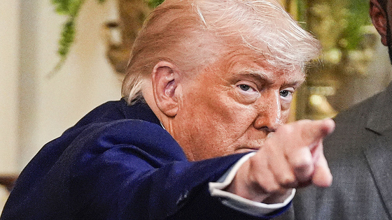 U.S. President Donald Trump gestures as he departs after hosting the 2025 NCAA Champions, the University of Florida men's basketball team, in the East Room of the White House in Washington on May 21. [AP/YONHAP]