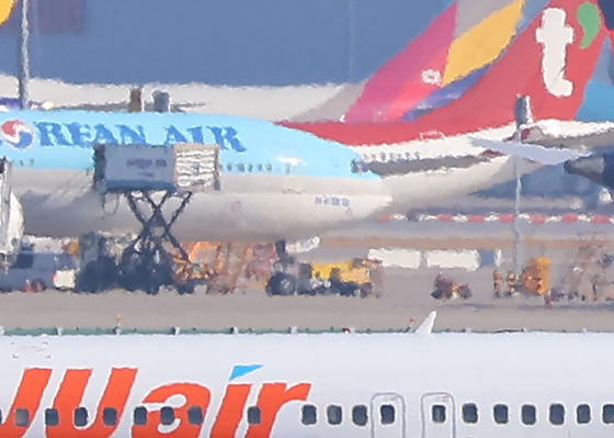Jeju Air, T'way Air and Korean Air airplanes are seen at Incheon International Airport on Jan. 7. [YONHAP] 