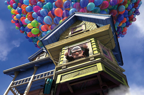 Pixar's ″Up″ (2009) is a movie about an older adult leaving on an adventure by attaching balloons to his house. [PIXAR]