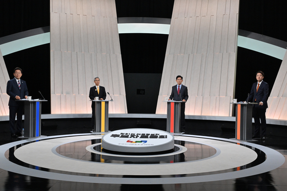 From left, Lee Jae-myung of the Democratic Party, Kwon Young-kook of the Democratic Labor Party, Kim Moon-soo of the People Power Party and Lee Jun-seok of the minor Reform Party take part in their third and final debate at the MBC studio in Mapo District, western Seoul, on May 27. [JOINT PRESS CORPS]