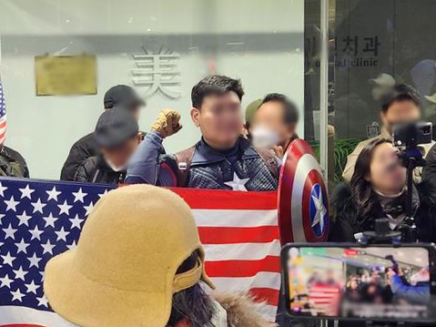 A man wearing Captain America's iconic costume shows up at the National Human Rights Commission of Korea's building in Seoul on Feb. 10. [YONHAP]