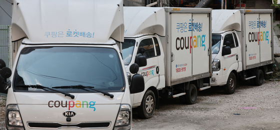 Coupang delivery trucks are parked in Seoul on May 7. [YONHAP]