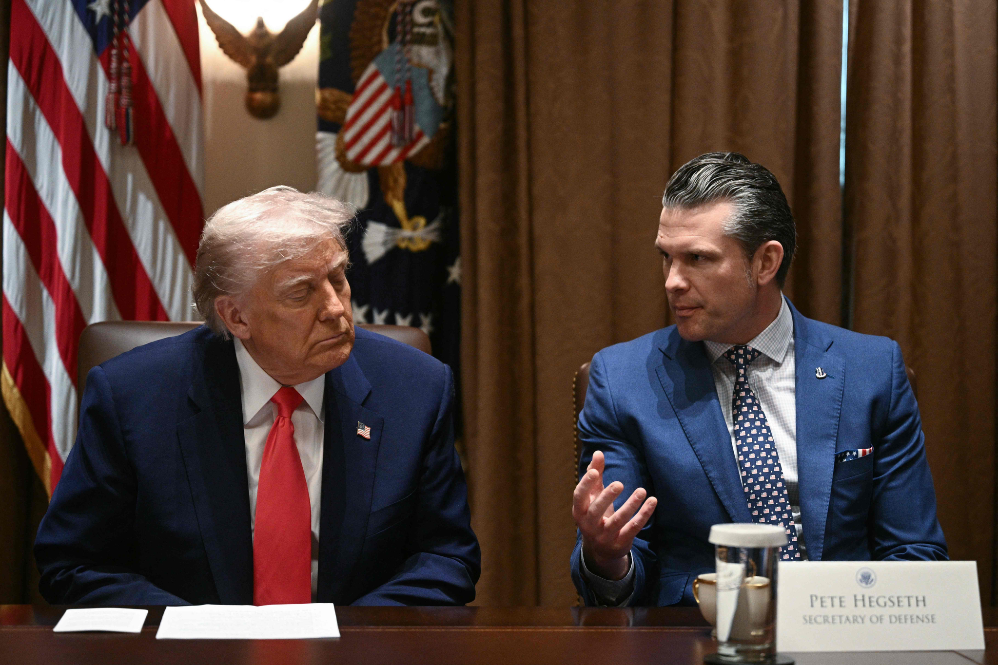 U.S. President Donald Trump looks on as Secretary of Defense Pete Hegseth speaks during a cabinet meeting in the Cabinet Room of the White House in Washington on April 10. [AFP/YONHAP]