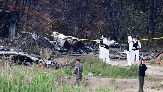 Navy officials conduct a forensic operation at the scene of the crash in Pohang, North Gyeongsang, on May 30, where a Navy patrol aircraft crashed on May 29. [YONHAP]