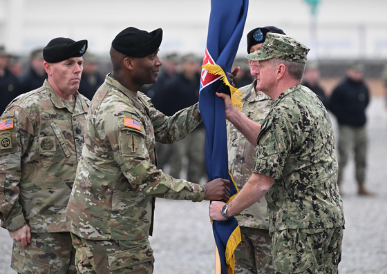 General Xavier T. Brunson receives the United States Forces Korea flag from U.S. Navy admiral Samuel John Paparo, commander of United States Indo-Pacific Command, during a change-of-command ceremony for the United Nations Command, Combined Forces Command, and United States Forces Korea at Camp Humphreys in Pyeongtaek on Dec. 20, 2024. [JOINT PRESS CORPS]