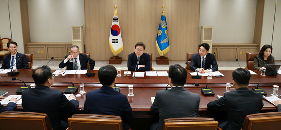 President Lee Jae-myung speaks at a meeting during his first day in the office on June 4 in central Seoul. [JOINT PRESS CORPS]