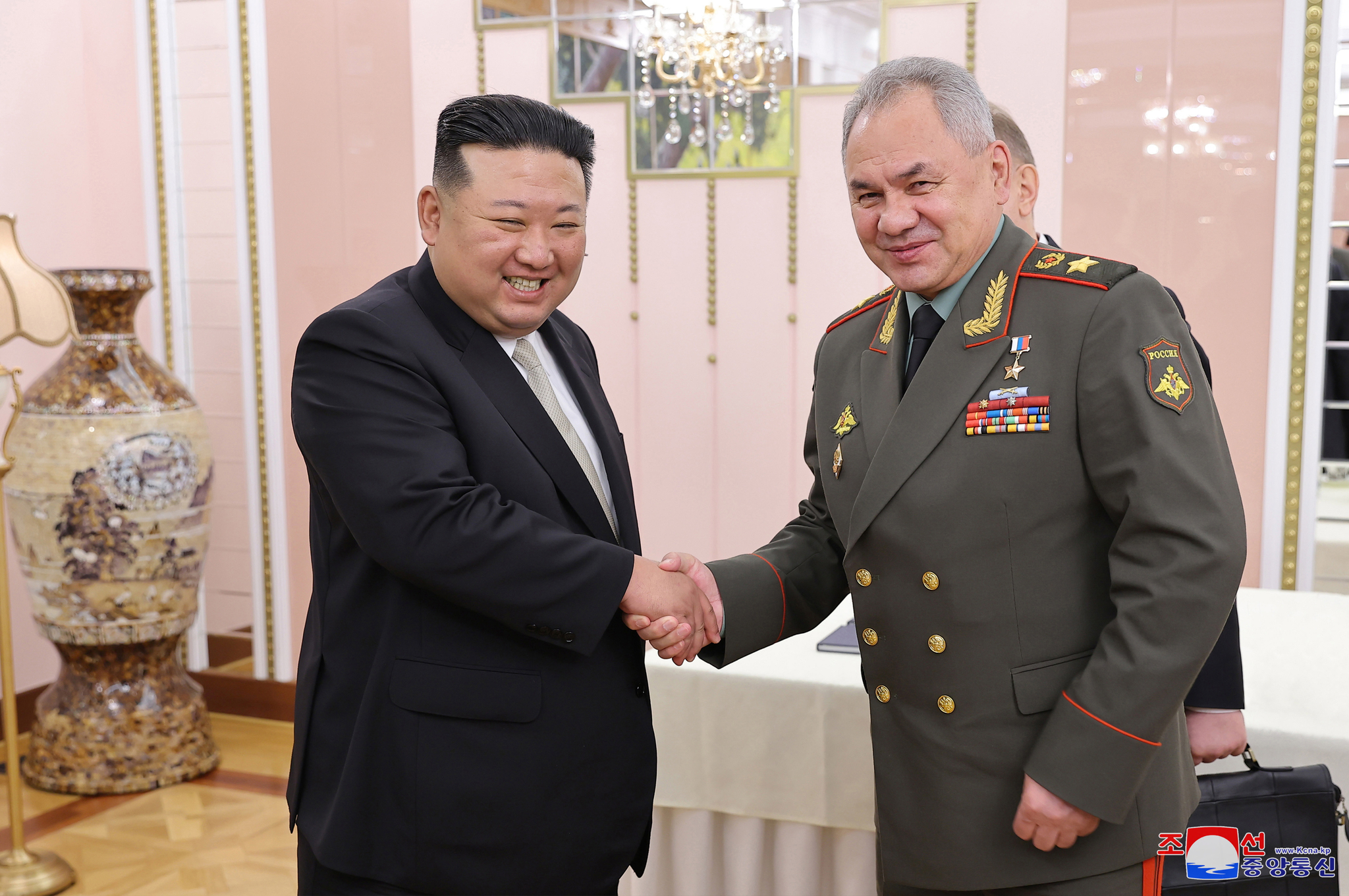 A photo released by the North Korean Central News Agency shows North Korean leader Kim Jong-un, left, shaking hands with Sergei Shoigu during a meeting at the office building of the Party Central Committee in Pyongyang, North Korea, on July 26, 2023. [EPA/YONHAP]