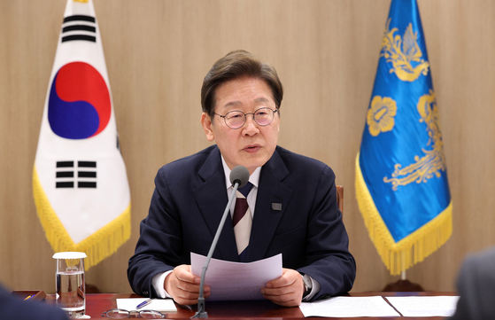 President Lee Jae-myung speaks at a meeting during his first day in the office on June 4 in central Seoul. [JOINT PRESS CORPS]