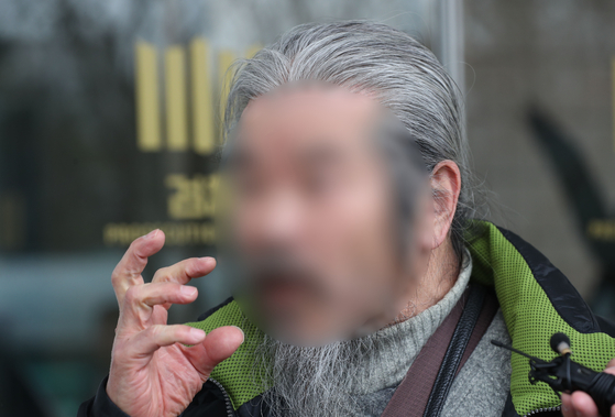 Child rapist Cho Doo-soon speaks to reporters after a trial at the Ansan branch of the Suwon District Prosecutors’ Office in Danwon District, Ansan, Gyeonggi, on March 11, 2024. [NEWS1] 