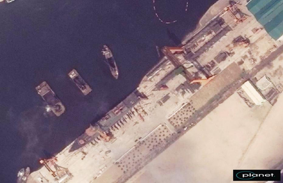 This satellite image, taken May 15, 2025, and provided by South Korea's unification ministry on May 22, shows a North Korean warship under preparation for launch after being built in the northeastern port city of Chongjin. [MINISTRY OF UNIFICATION]