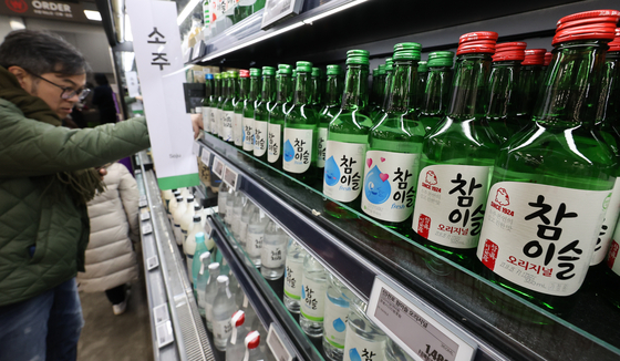 Bottles of soju are displayed at a major supermarket in Seoul on Dec. 21, 2023. [NEWS1] 